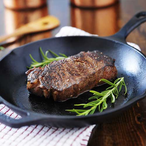 steak in an iron skillet
