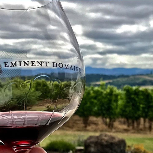 Close up of the Eminent Domaine logo on a wine glass