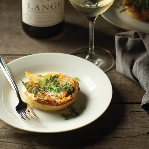 A specialty meal plated with wine at The Kitchen at Middleground Farms