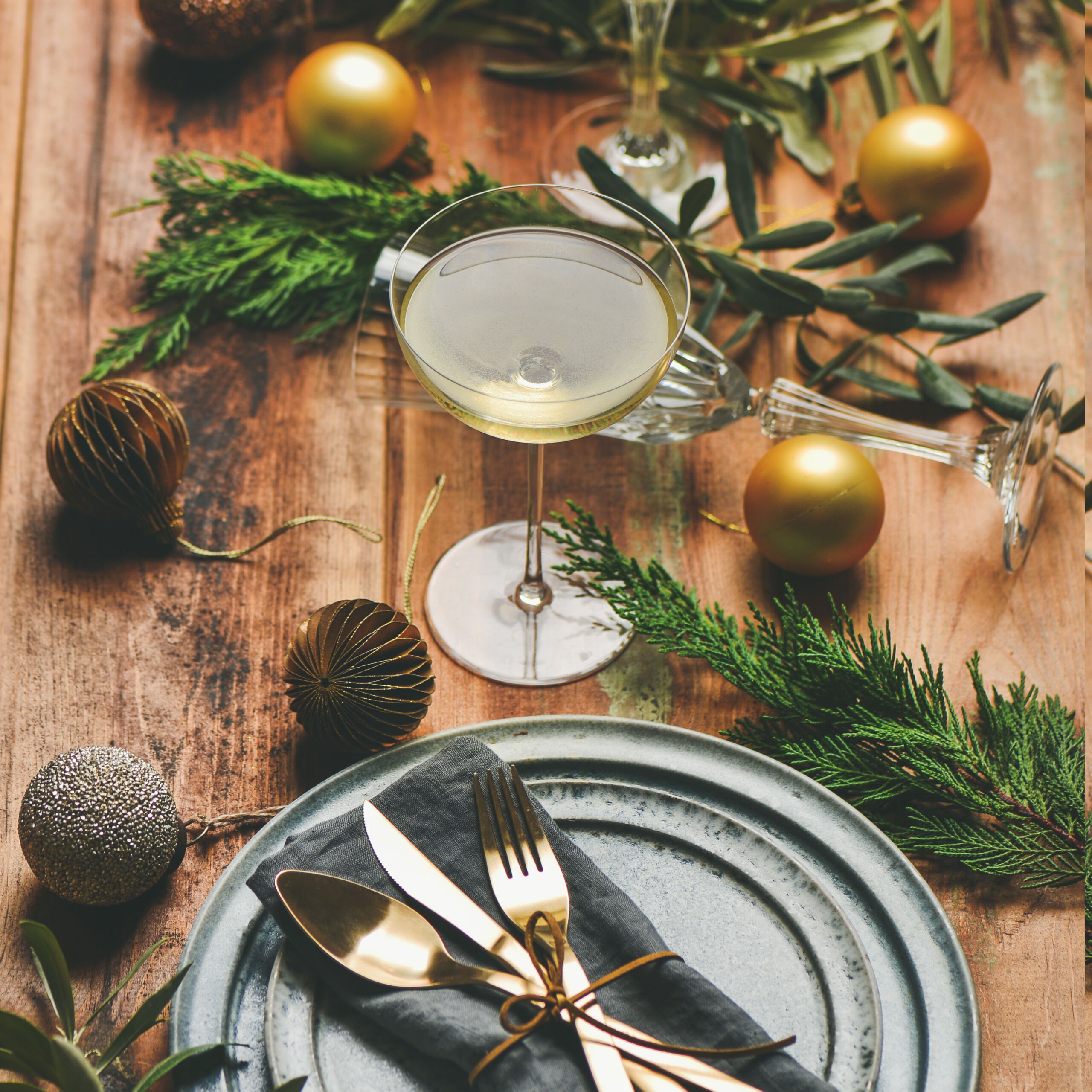 Holiday celebration table setting over rustic wooden background, square crop